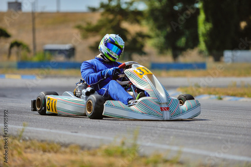 Young go cart racer on circuit