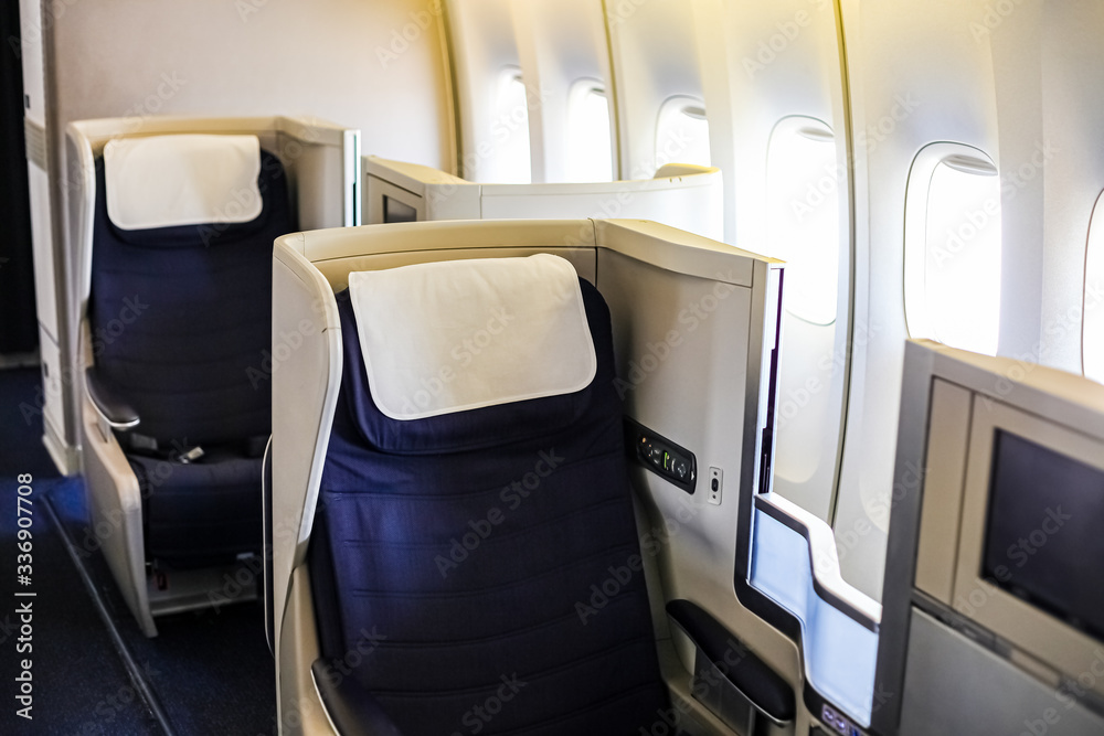 Fototapeta premium Interior view of Empty Airplane seats on board a jet liner