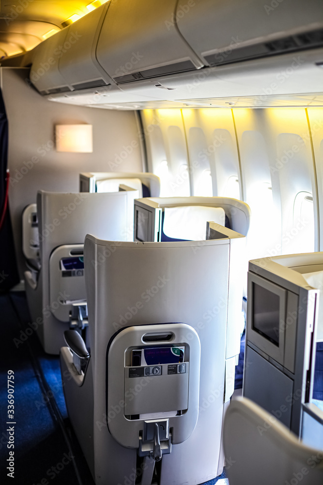 Interior view of Empty Airplane seats on board a jet liner Interior view of Empty Airplane seats on board a jet liner