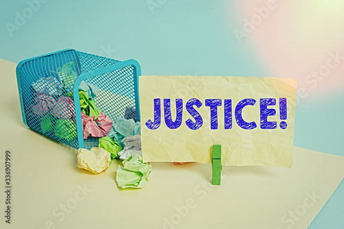 Word writing text Justice. Business photo showcasing impartial adjustment of conflicting claims or assignments Trash bin crumpled paper clothespin empty reminder office supplies tipped photo