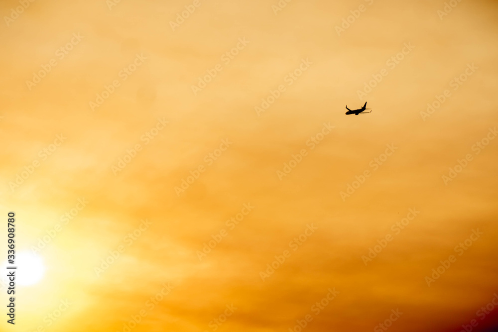 Plane flying during golden hour