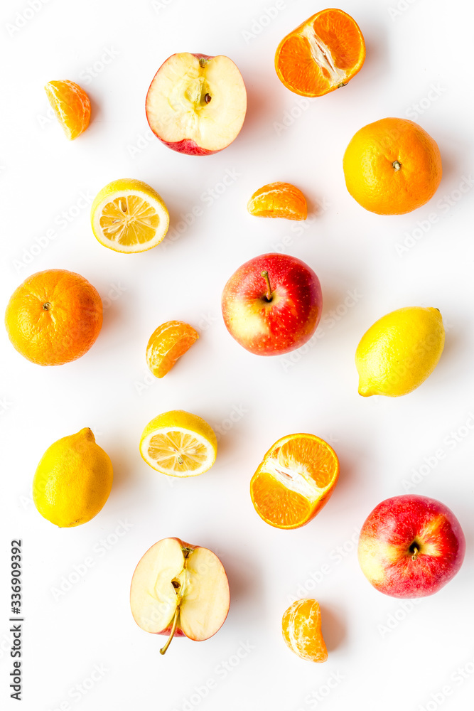 Colorful summer fruits background on white table top view Colorful summer fruits background on white table top view