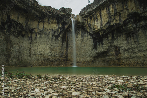 Sopot waterfall in Istria, Croatia, a popular tourist destination in the middle of Istrian countryside. 30 meter high waterfall with old arched bridge above it. photo