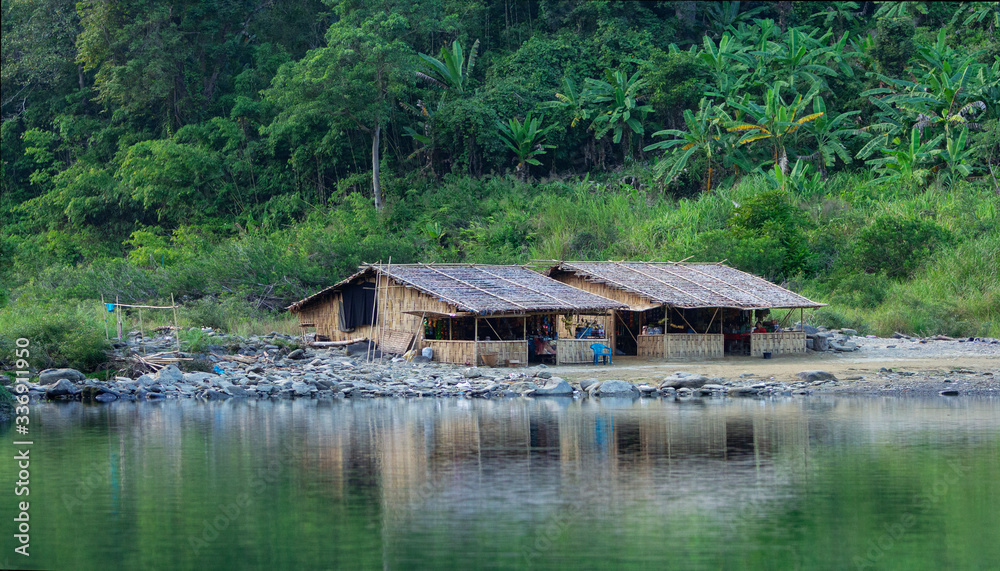 The tiny house between the river and mountain. The tiny house between the river and mountain.
