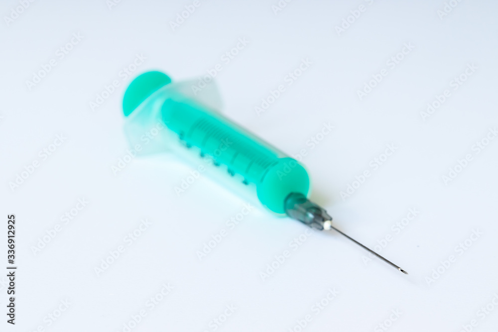 Disposable medical syringes on a white background Disposable medical syringes on a white background