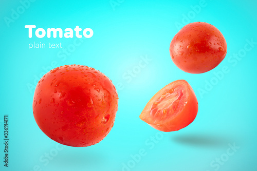 Fresh flying tomatoes on a blue background with drops. Tomatoes with full depth of coldness