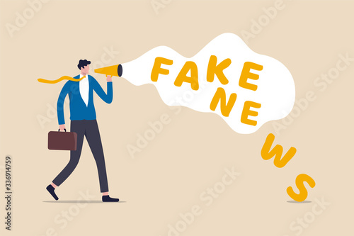 Fake news or misleading information that people share on social media and internet concept, businessman holding megaphone talking or telling fake news.
