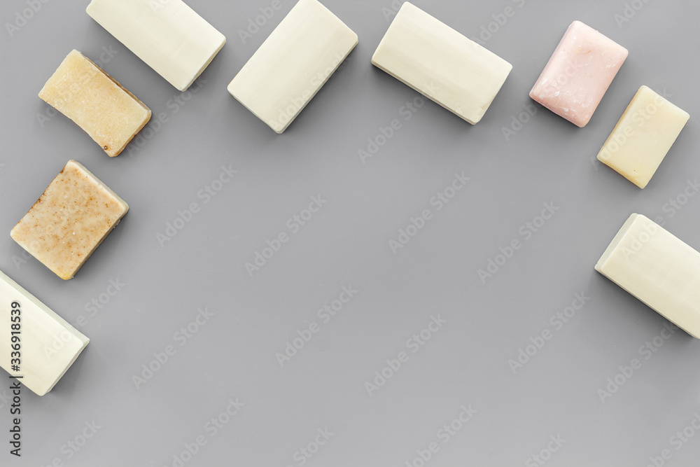 Soap bars flat lay on grey background top-down copy space frame Soap bars flat lay on grey background top-down copy space frame
