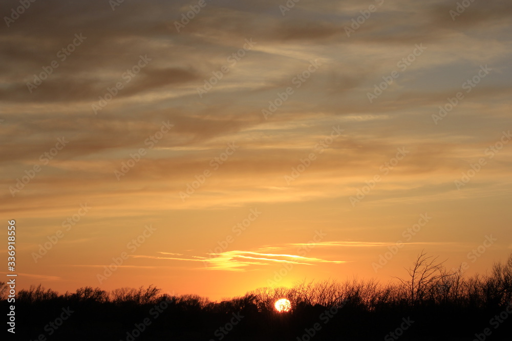Sunset out in the country in Kansas with a colorful sky. Sunset out in the country in Kansas with a colorful sky.