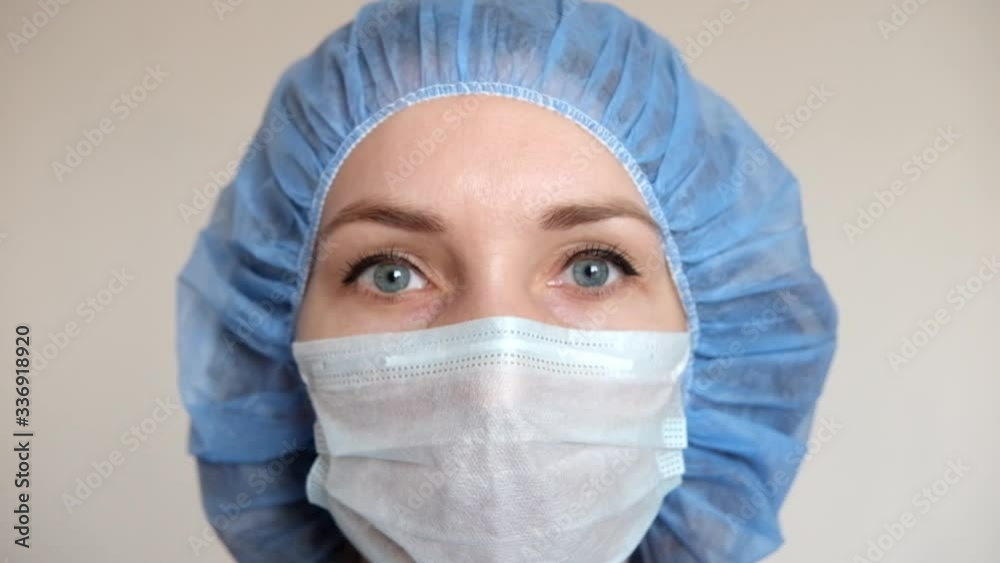 A doctor in a medical mask and protective suit against covid-19. A doctor in a medical mask and protective suit against covid-19.