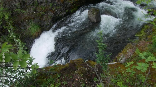 Downwards panning shot of Moul Falls from the top of the waterfall in Wells Gary Provincial Park photo