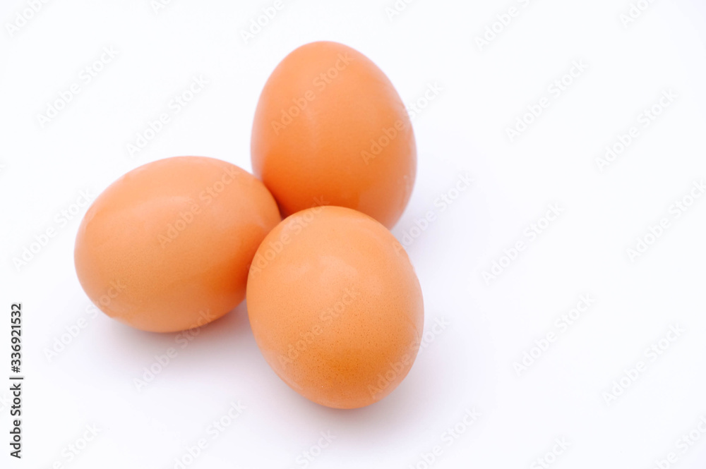 Close-up view of raw chicken eggs on white background Close-up view of raw chicken eggs on white background