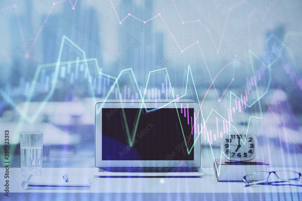 Forex graph hologram on table with computer background. Multi exposure. Concept of financial markets. Forex graph hologram on table with computer background. Multi exposure. Concept of financial markets.