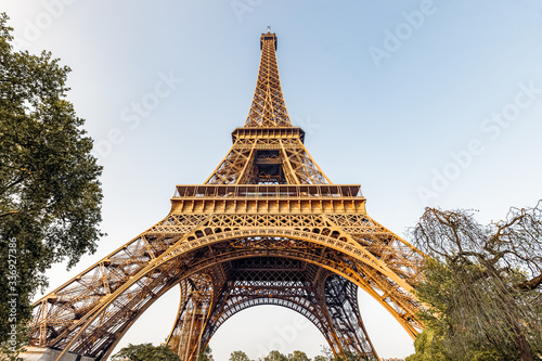 Eiffel tower against blue sky. Wide angle shot from below. Paris, France.  © Telly
