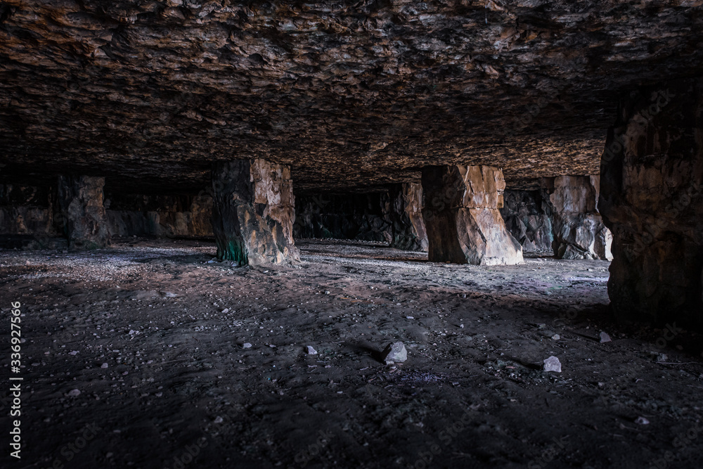 The supporting roof pillars inside the manmade Winspit Quarry Caves, Isle of Purbeck, Dorset, UK