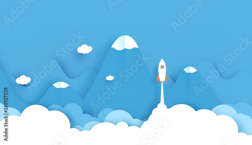 Wide landscape with Rockets glide over the mountains with views over the beautiful clouds on blue background. Business concept. Paper cut style. vector illustration