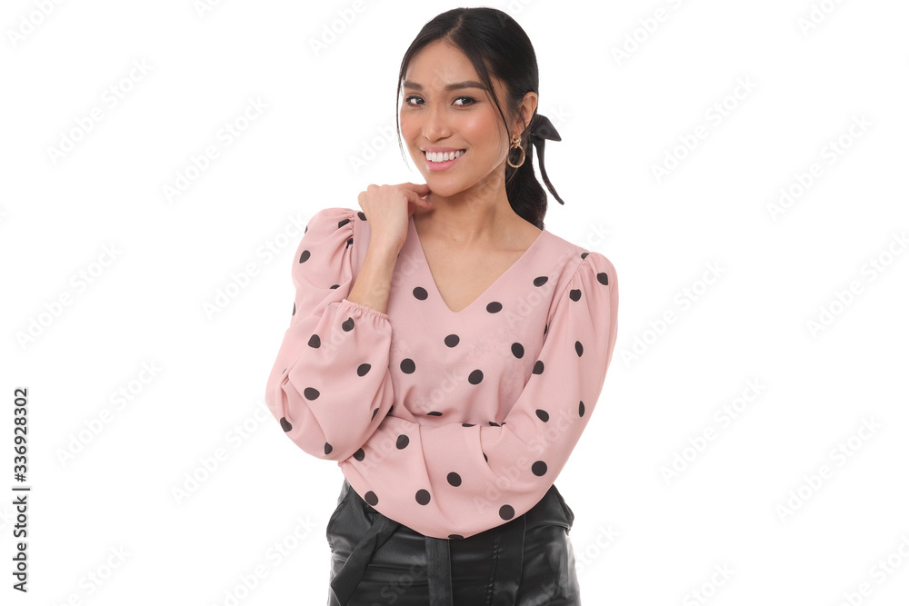 Beautiful asian model in leather skirt and pink shirt with black dots. Beautiful asian model in leather skirt and pink shirt with black dots.