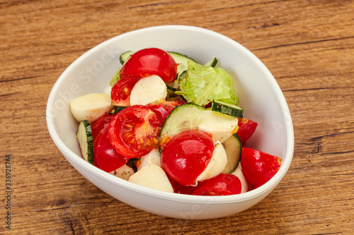 Salad with vegetables and mozzarlla photo