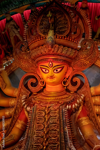 Idol of Goddess Devi Durga at a decorated puja pandal in Kolkata  West Bengal  India. Durga Puja is a popular and major religious festival of Hinduism that is celebrated throughout the world.