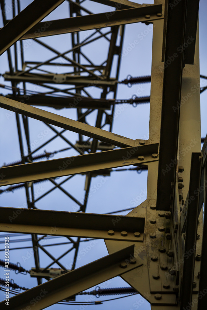 Naklejka premium bolting of a power pole with many cross braces