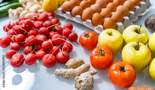 Top view of mixed vegetables. Reddish in front. Organic food concept. Stay healthy. Fresh products consuming photo