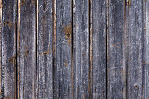 Vintage brown wood background texture with knots and nail holes. Old painted wood wall. Brown abstract background. Vintage wooden dark horizontal boards. Front view with copy space. 