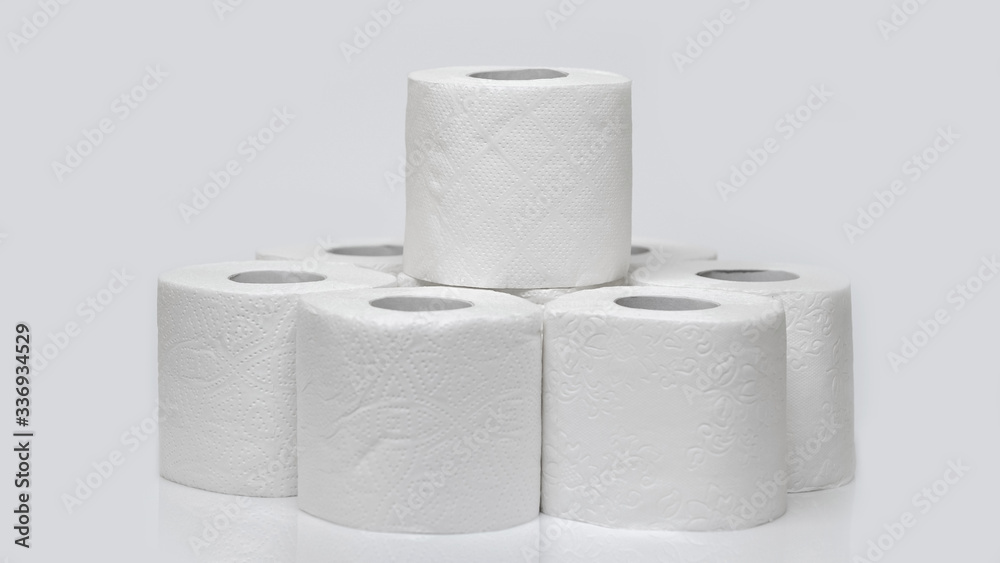 Rolls of toilet paper on a white background. Outbreak of the coronavirus concept COVID-19. Coronavirus - 2019-nKoV. Stay at home while in quarantine. Rolls of toilet paper on a white background. Outbreak of the coronavirus concept COVID-19. Coronavirus - 2019-nKoV. Stay at home while in quarantine.