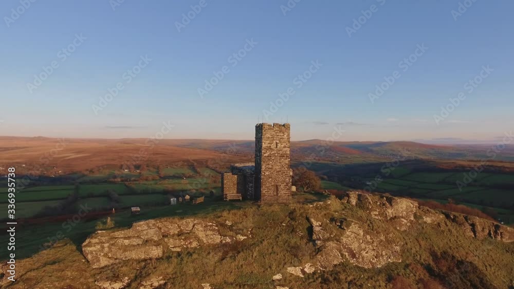 Drone shot of historic building on a rocky hill at sunset Drone shot of historic building on a rocky hill at sunset