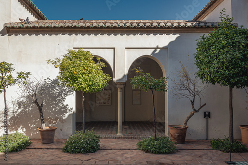 Alcazaba interior courtyard with covered walkway in Malaga.