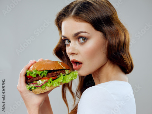 woman eating hamburger