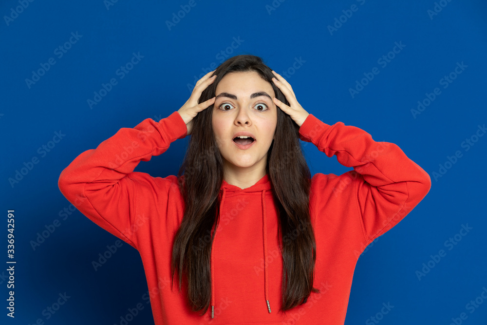 Brunette young girl wearing red jersey Brunette young girl wearing red jersey