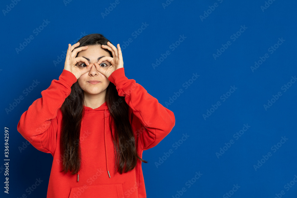 Brunette young girl wearing red jersey Brunette young girl wearing red jersey