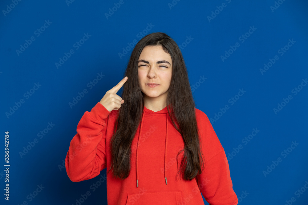 Brunette young girl wearing red jersey Brunette young girl wearing red jersey