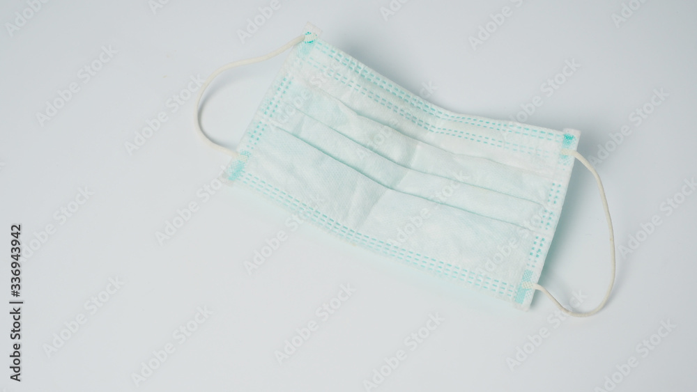 Disposable Ear- loop face mask on white background.
