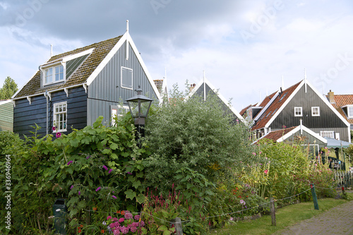 Typical Dutch village scene with wooden houses on the island of Marken in the Netherlands, Holland