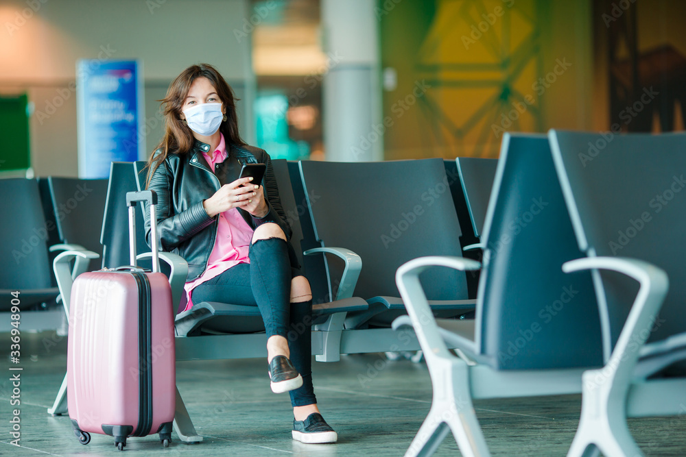 Young tourist woman with baggage in international airport Young tourist woman with baggage in international airport