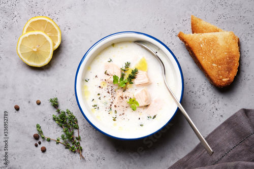Creamy fish soup served with thyme. Traditional Finnish Kalakeitto Salmon Soup