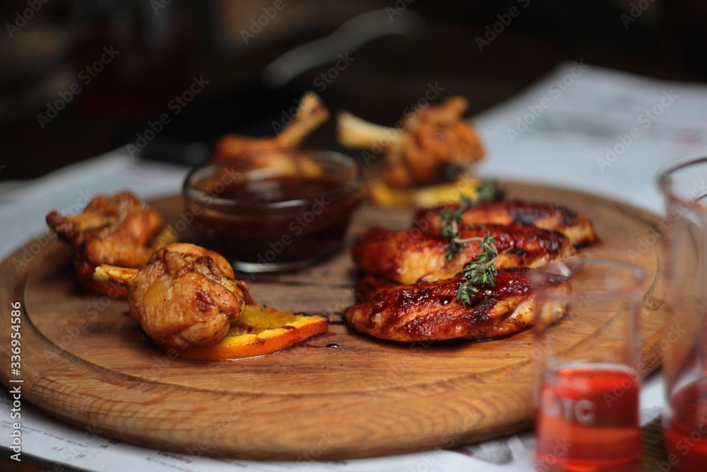 delicious chicken wings on a wooden tray delicious chicken wings on a wooden tray