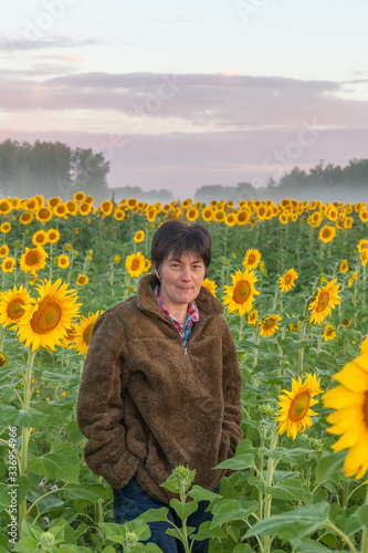 Female tourist in the sunflower field  selective focus