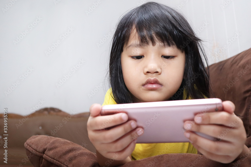 Little Girl Plays with Gadget Smart Phone Little Girl Plays with Gadget Smart Phone