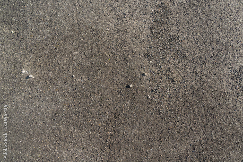 Texture of dark grey asphalt with small stones Texture of dark grey asphalt with small stones
