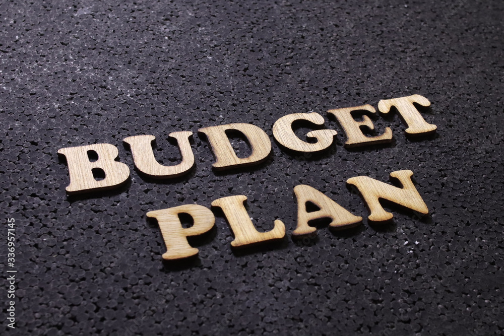 Budget plan, business motivational inspirational quotes, wooden words typography lettering concept Budget plan, business motivational inspirational quotes, wooden words typography lettering concept