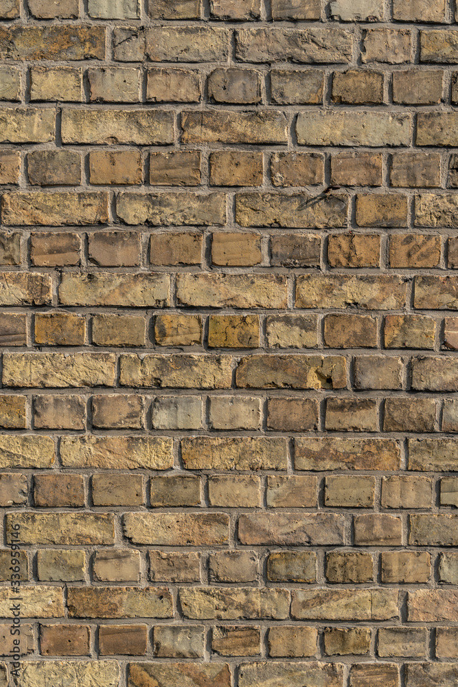 Fototapeta premium Texture of yellow and sand colored bricks