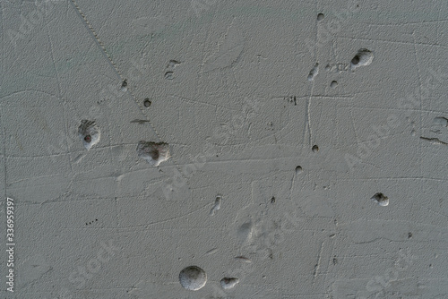 Texture of grunge and concrete wall with small holes photo