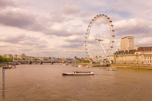 London Eye and the Thames river during a sunset, London, England, UK