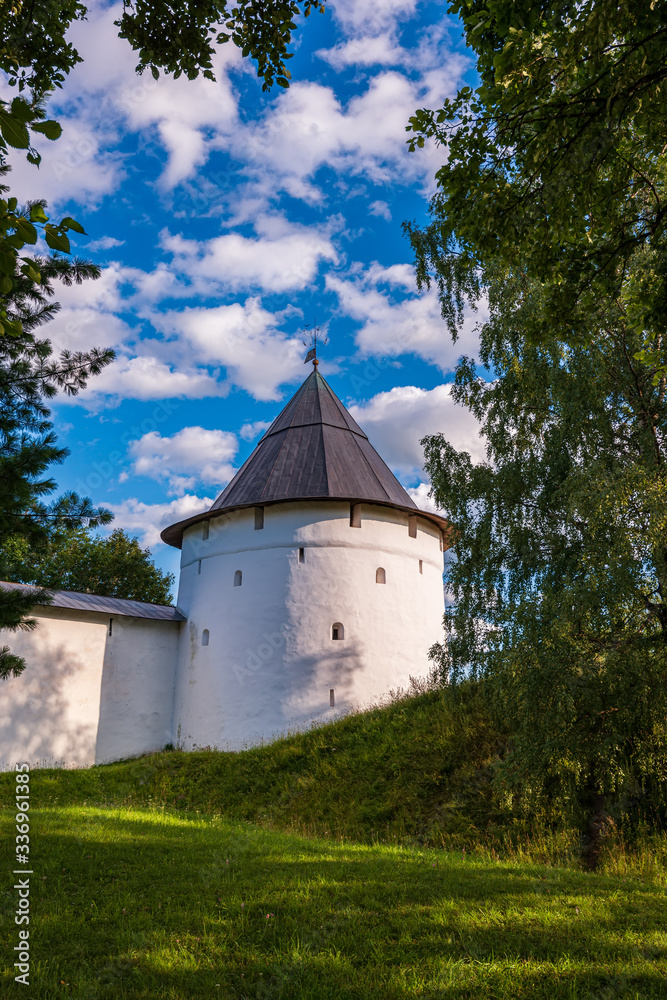 Towers and fortress walls of the monastery. Svyato-Uspenskiy Pskovo-Pechersk monastery near Pskov, “God zdania cave.”
