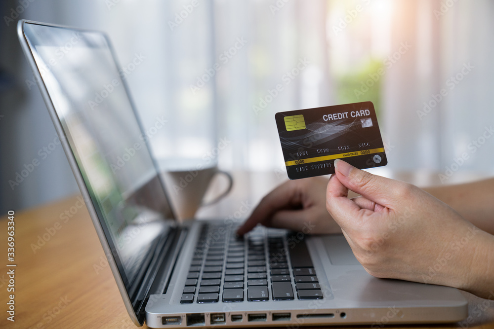 Woman using smart mobile phone with credit card for online shopping. Woman using smart mobile phone with credit card for online shopping.