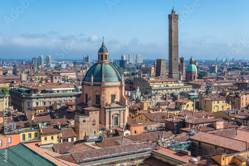 Panorama of historic part of Bologna city, Italy - view from St Petronius Basilica with dome of Santa Maria della Vita church and Two Towers photo