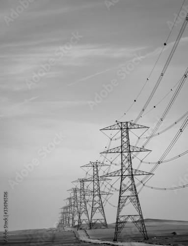 high KV electric posts makes a beautiful leading line through desert