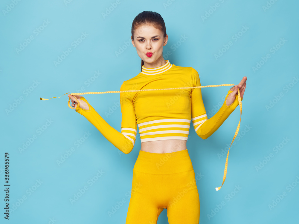 young woman holding a yellow arrow sport fitness young woman holding a yellow arrow sport fitness